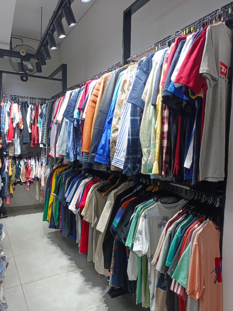 Men's shirts and apparel racks at Masees Ambur
